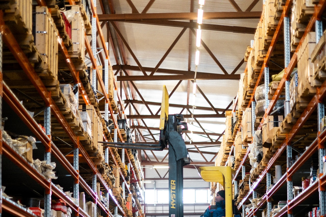 A forklift moving pallets inside a distribution centre